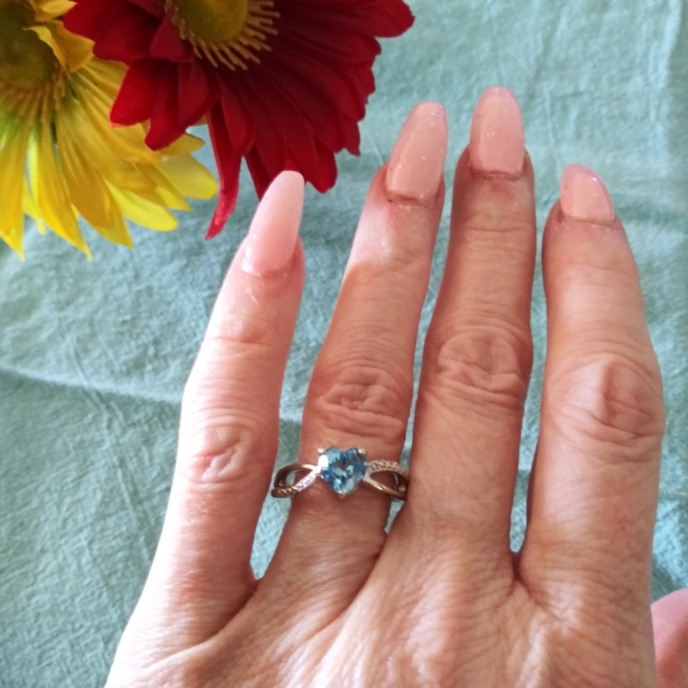 Genuine blue topaz heart Ring with diamond accent